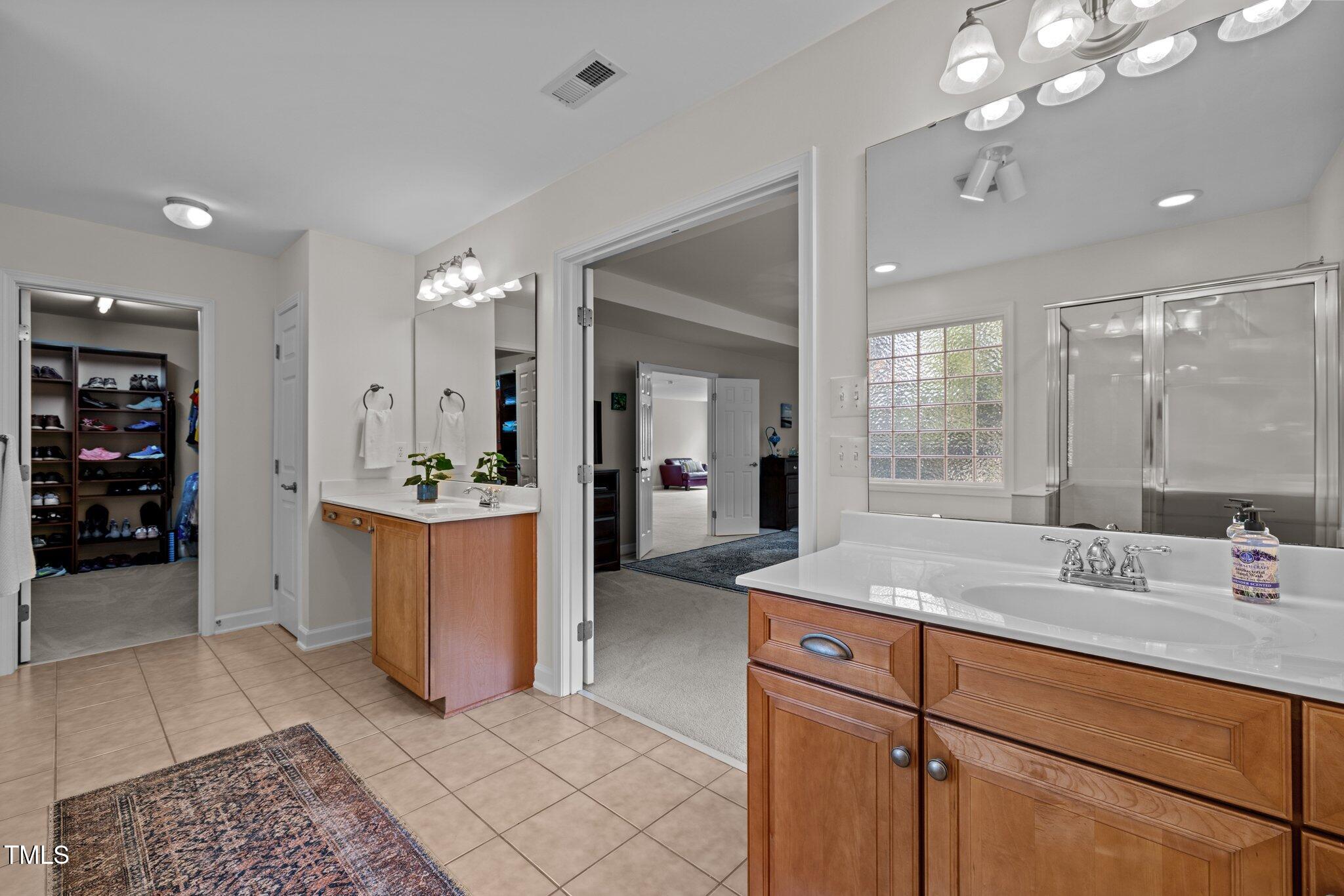 705 Harkness Circle Durham, NC 27705 - Photo 21 of 58 a room with sink and mirror
