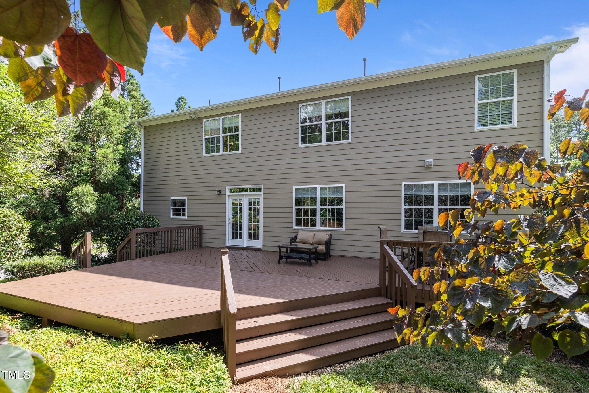 705 Harkness Circle Durham, NC 27705 - Photo 39 of 58 a view of a patio with table and chairs and potted plants