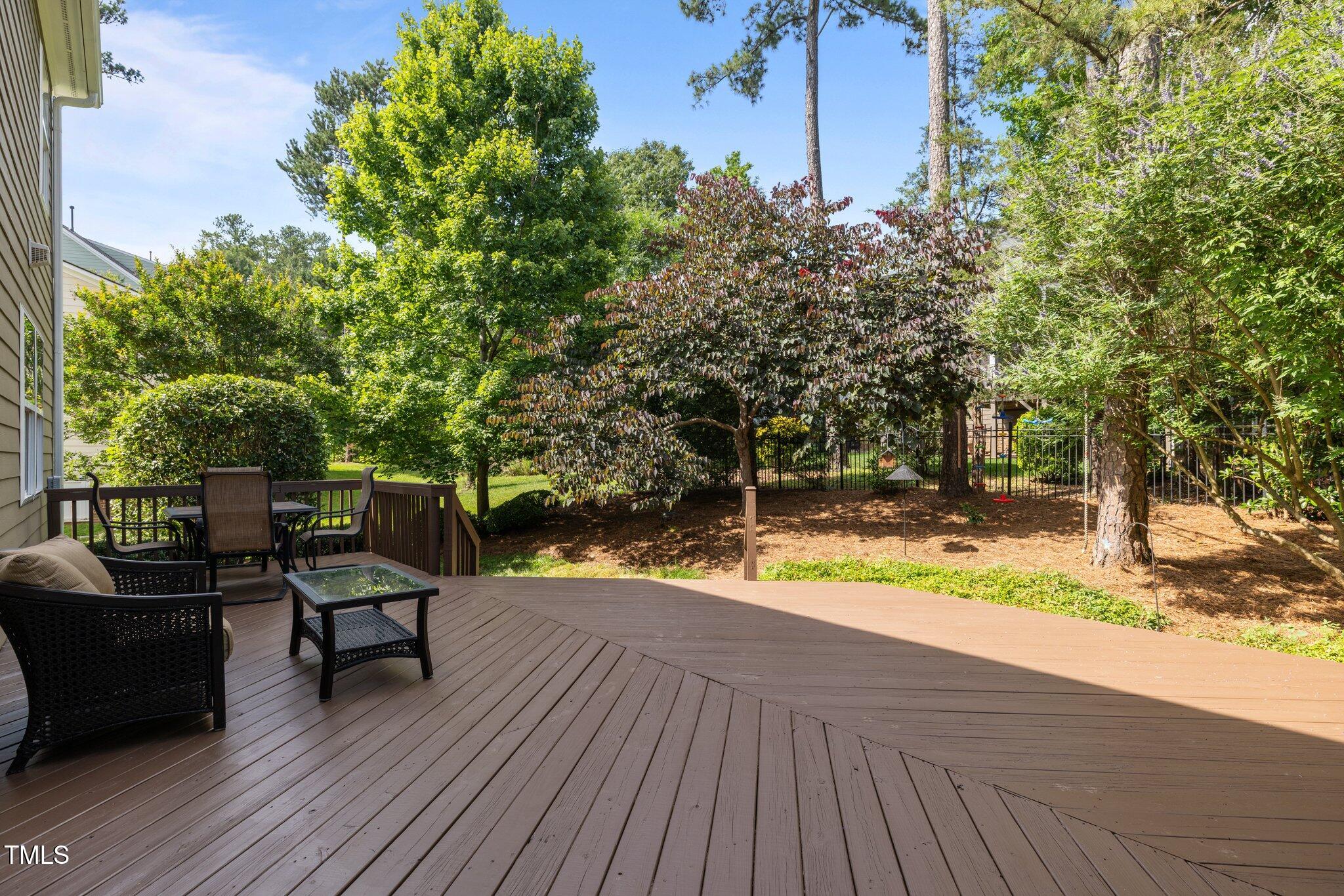 705 Harkness Circle Durham, NC 27705 - Photo 41 of 58 a view of a roof deck with table and chairs and wooden floor
