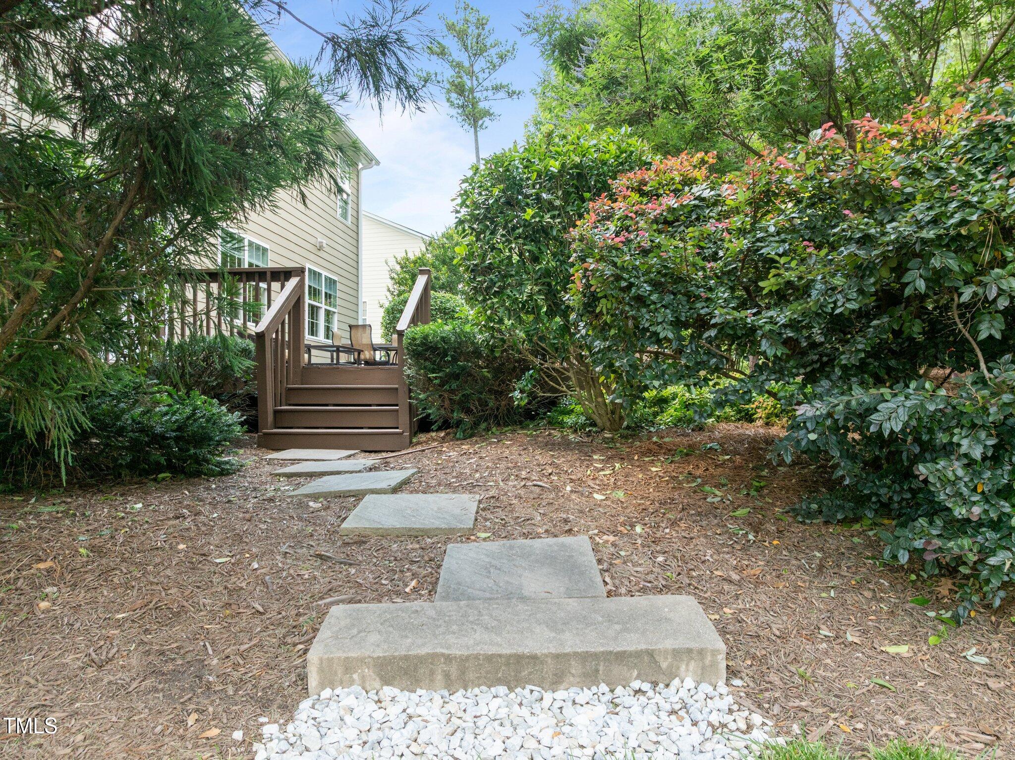 705 Harkness Circle Durham, NC 27705 - Photo 44 of 58 a view of a yard with plants and trees