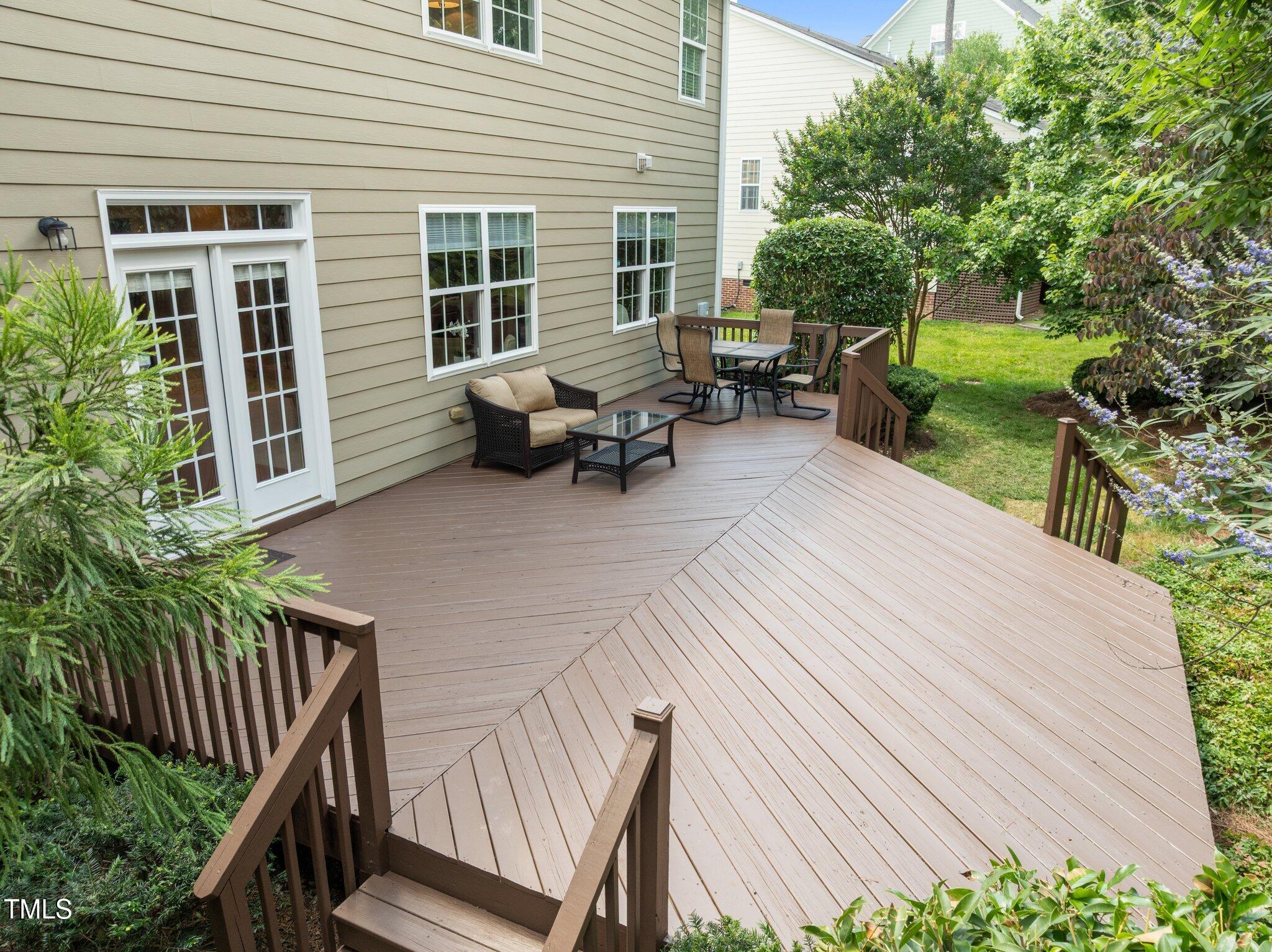 705 Harkness Circle Durham, NC 27705 - Photo 45 of 58 a view of a patio with chairs and potted plants