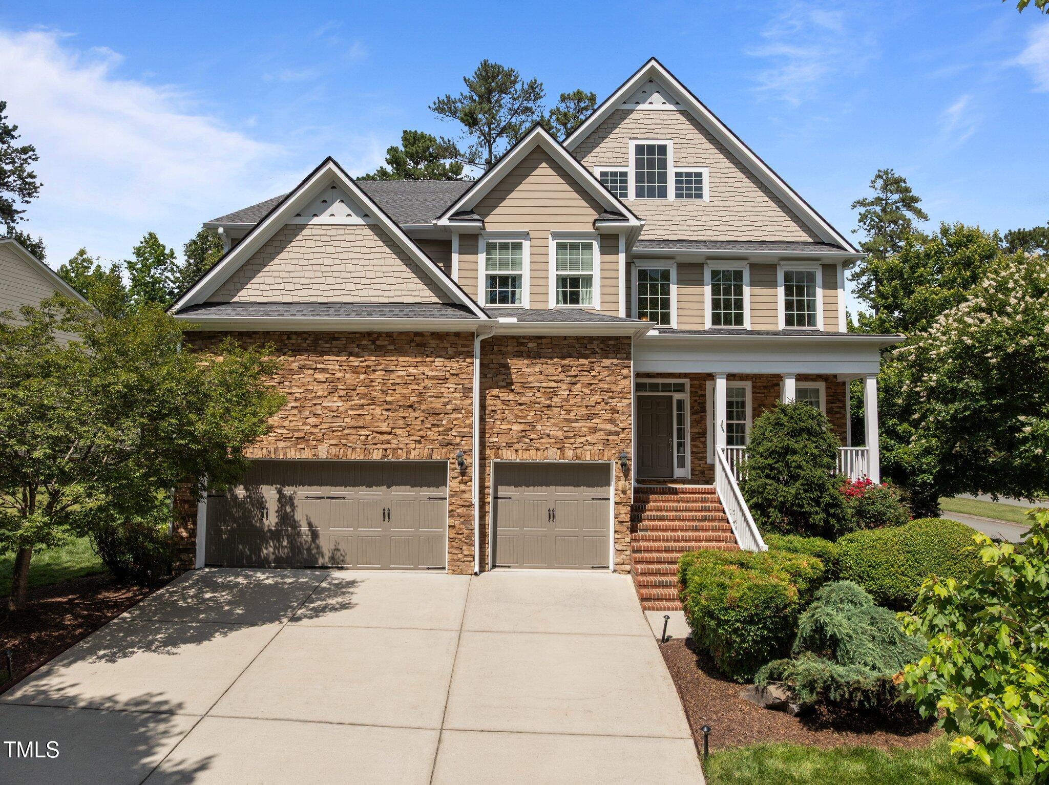 705 Harkness Circle Durham, NC 27705 - Photo 48 of 58 a front view of a house with a yard