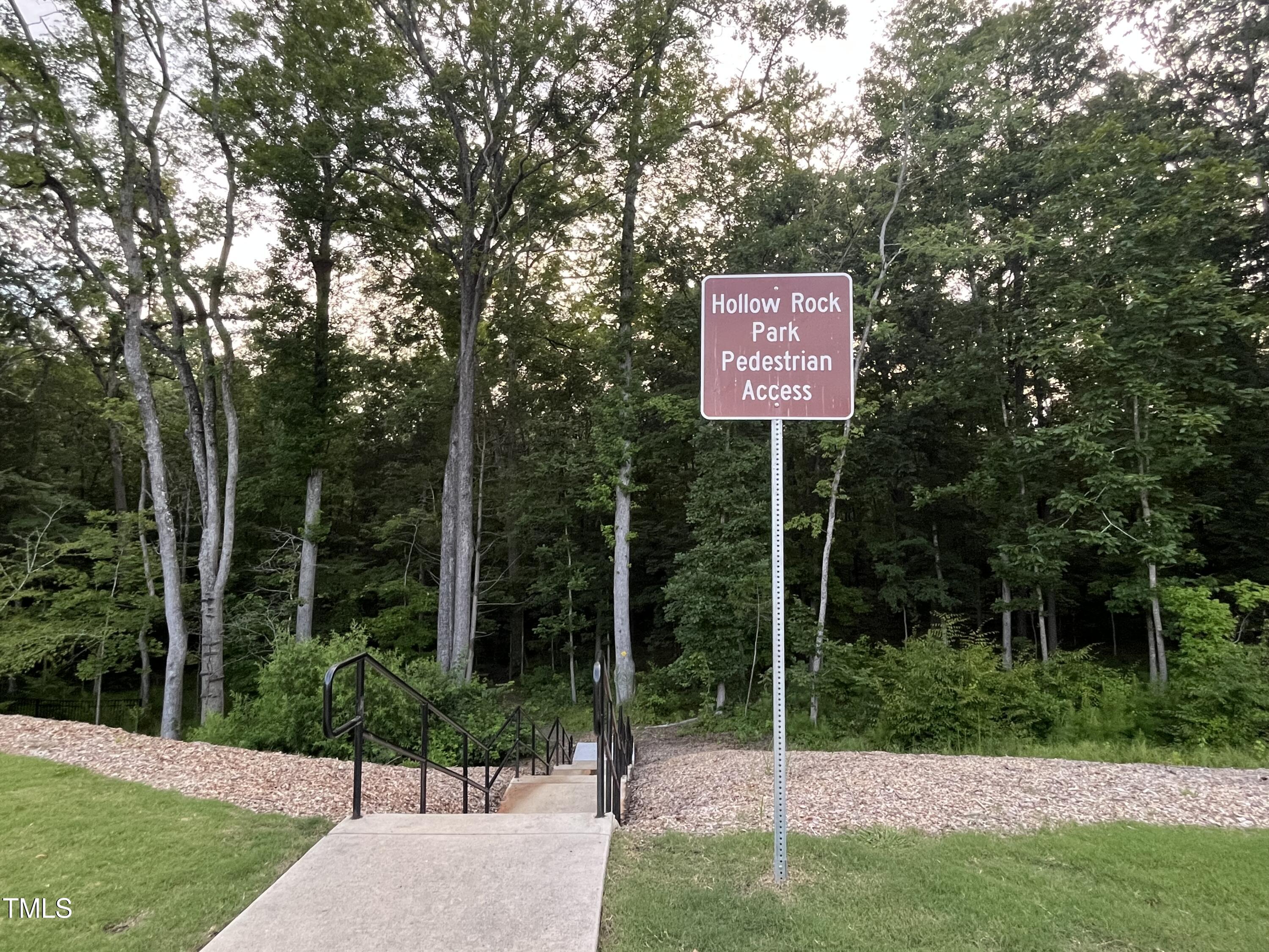 705 Harkness Circle Durham, NC 27705 - Photo 54 of 58 a view of a park with a bench and trees