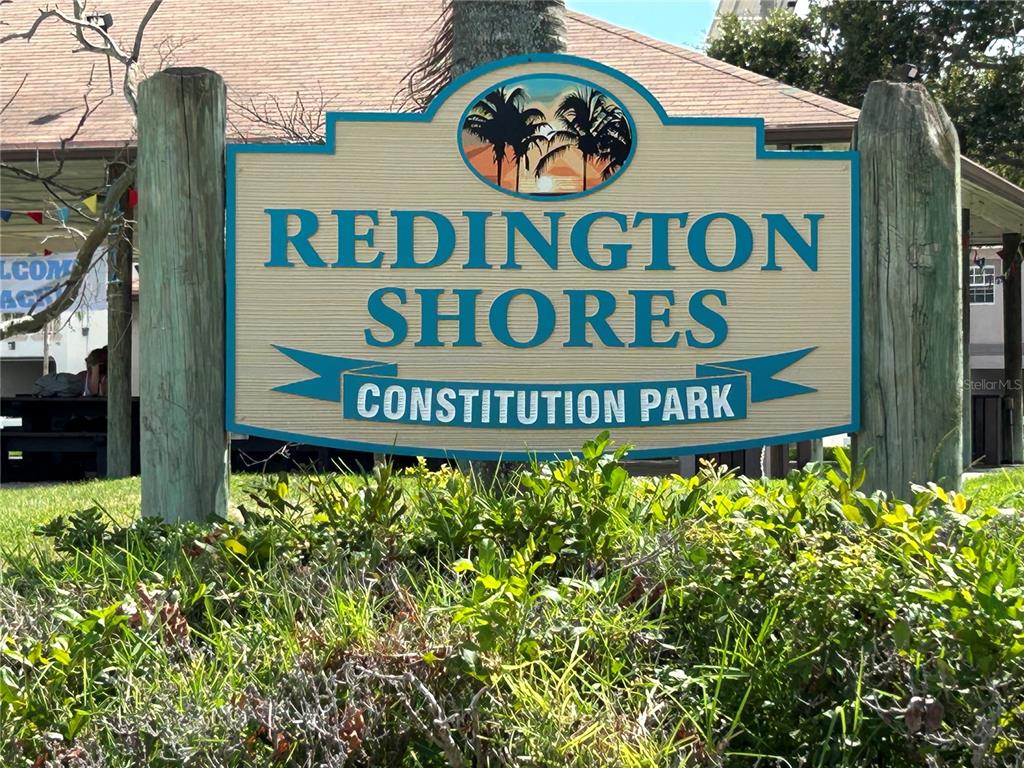415 180th Avenue East Redington Shores, FL 33708 - Photo 20 of 29 a sign broad in front of a building
