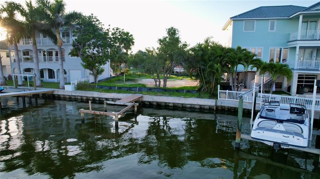 415 180th Avenue East Redington Shores, FL 33708 - Photo 28 of 29 an aerial view of a house with a lake view
