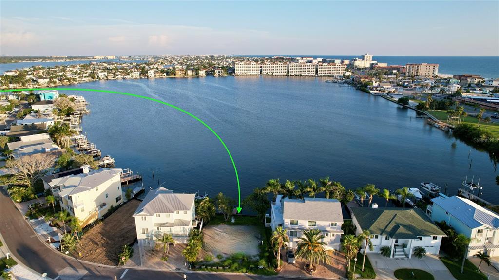 415 180th Avenue East Redington Shores, FL 33708 - Photo 3 of 29 an aerial view of a house with a lake view