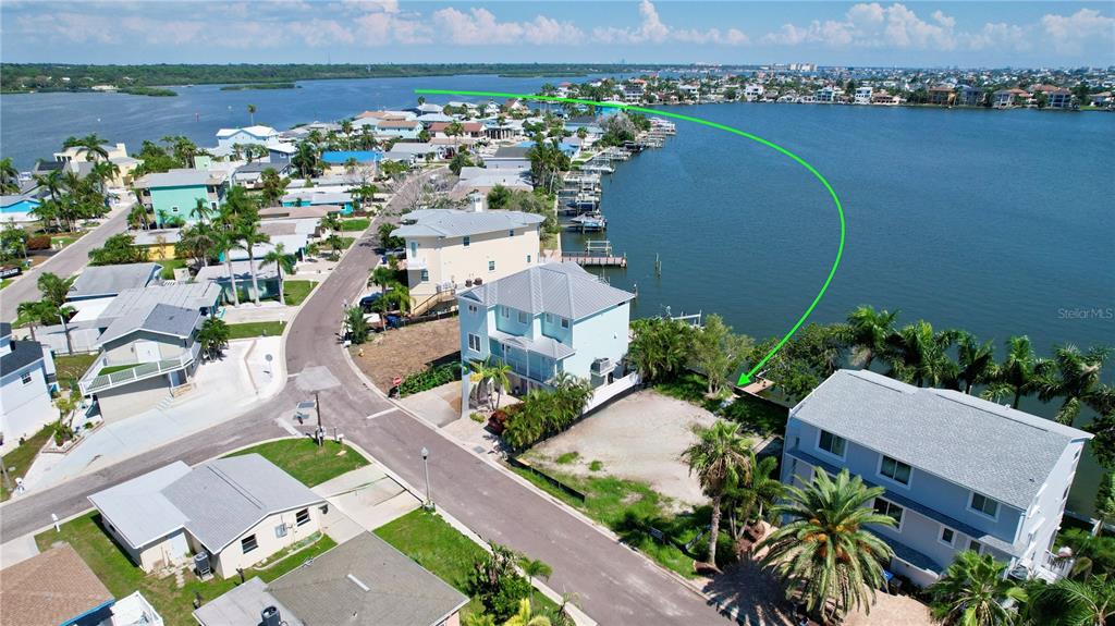 415 180th Avenue East Redington Shores, FL 33708 - Photo 5 of 29 an aerial view of a house with a lake view