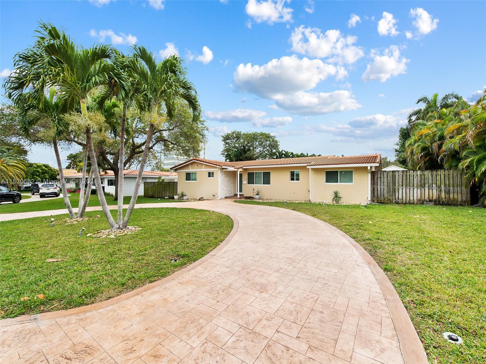 3444 Pierce Street Hollywood, FL 33021 - Photo 4 of 27 a front view of a house with garden