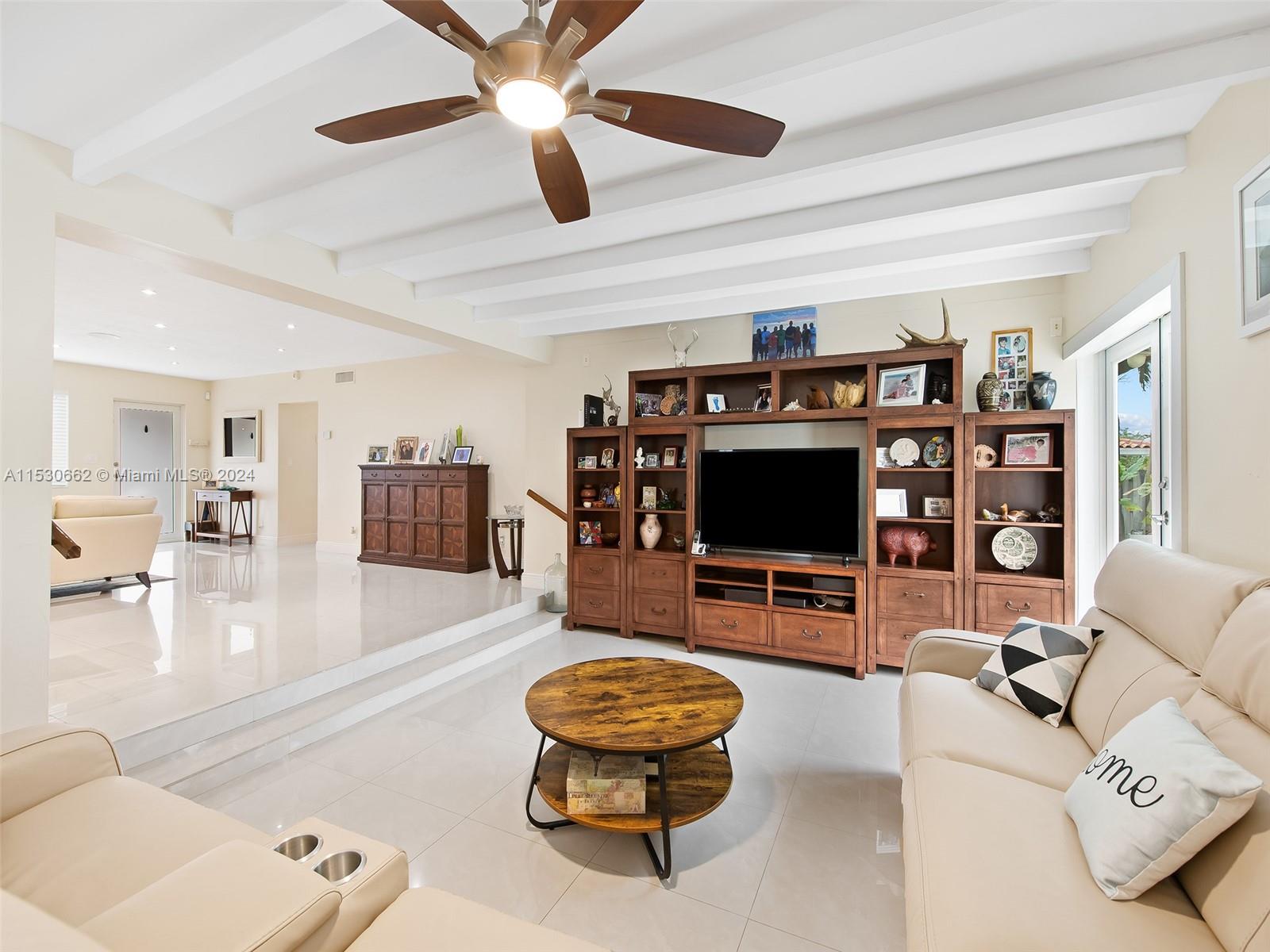 3444 Pierce Street Hollywood, FL 33021 - Photo 9 of 27 a living room with furniture and a flat screen tv