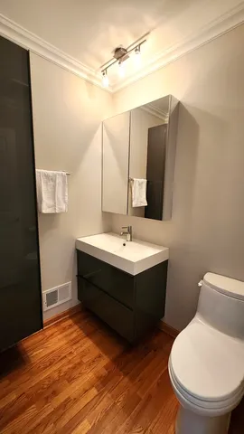 a bathroom with a sink and mirror