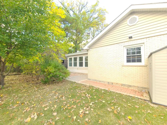 a view of yard with large trees