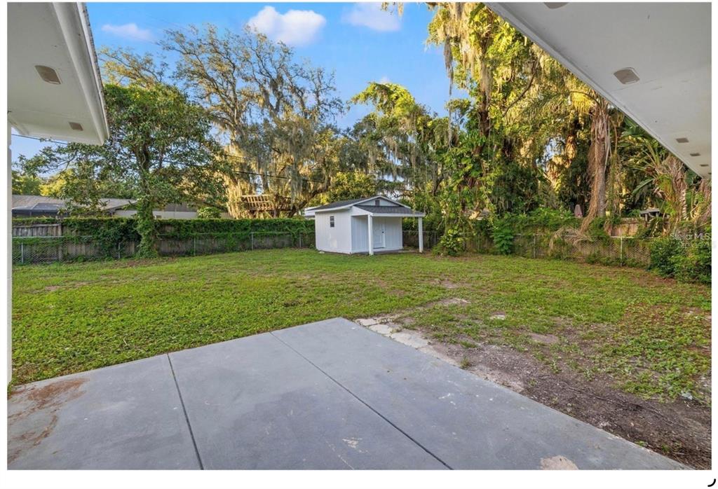 508 Brooker Road Brandon, FL 33511 - Photo 16 of 18 a view of a house with a yard