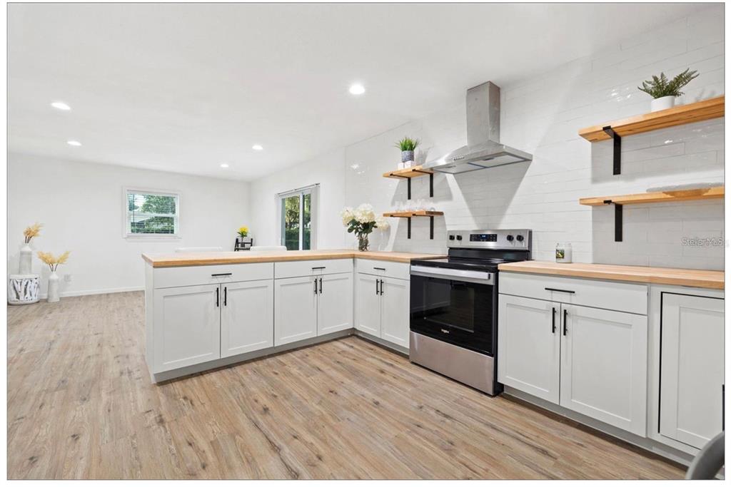 508 Brooker Road Brandon, FL 33511 - Photo 5 of 18 a kitchen with a sink a stove and cabinets