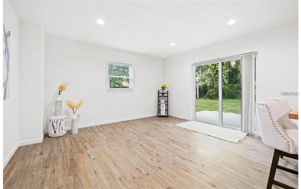 508 Brooker Road Brandon, FL 33511 - Photo 8 of 18 a view of an empty room with wooden floor and a window
