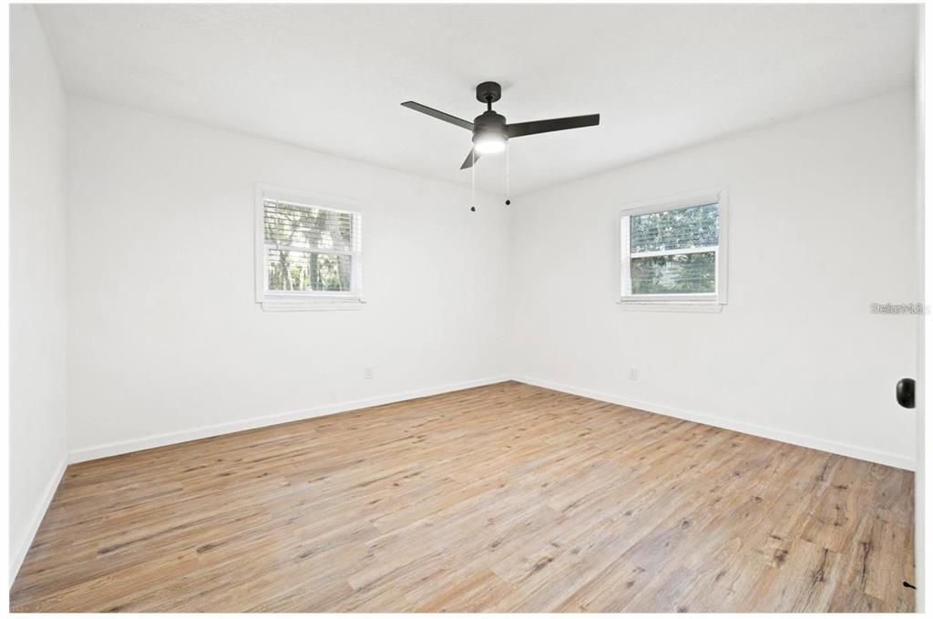 508 Brooker Road Brandon, FL 33511 - Photo 9 of 18 a view of empty room with wooden floor