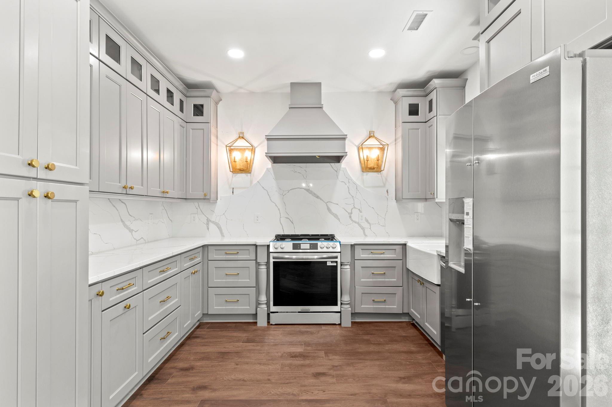 1167 Tirzah Road Rock Hill, SC 29732 - Photo 7 of 25 a kitchen with stainless steel appliances granite countertop a stove a sink and a refrigerator