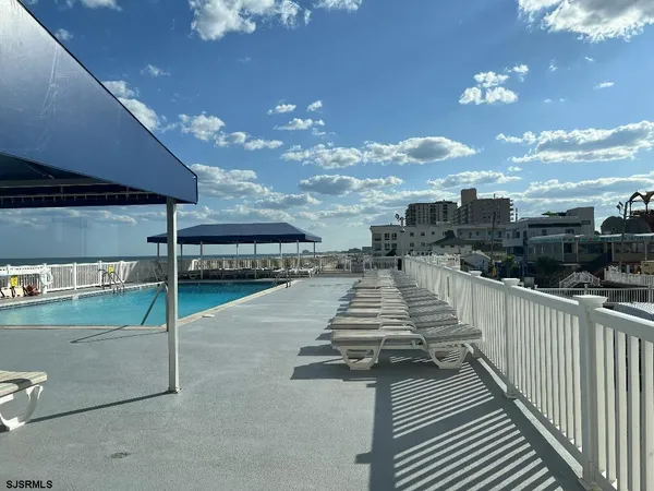 a view of a balcony with wooden floor