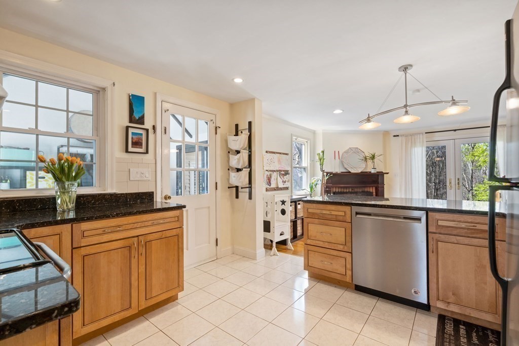 265 Riverside Drive Dedham, MA 02026 - Photo 12 of 41 a kitchen with stainless steel appliances granite countertop a refrigerator and a sink