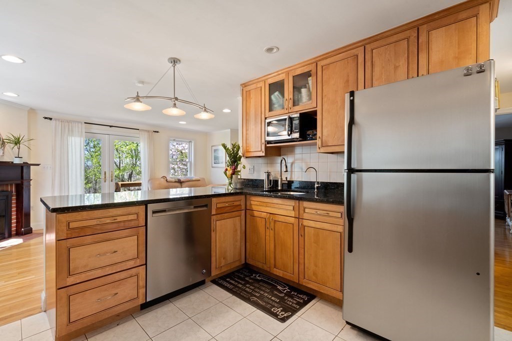 265 Riverside Drive Dedham, MA 02026 - Photo 13 of 41 a kitchen with stainless steel appliances a refrigerator sink and microwave