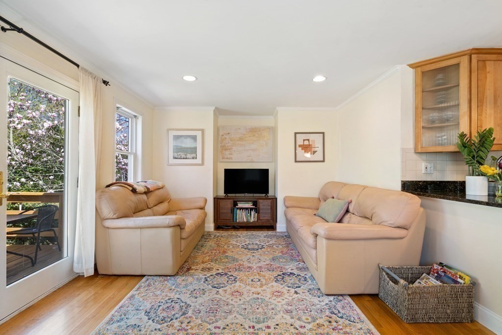 265 Riverside Drive Dedham, MA 02026 - Photo 17 of 41 a living room with furniture and a flat screen tv