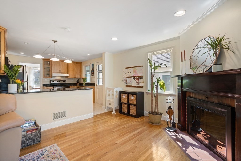 265 Riverside Drive Dedham, MA 02026 - Photo 19 of 41 a view of a kitchen with furniture and a fireplace