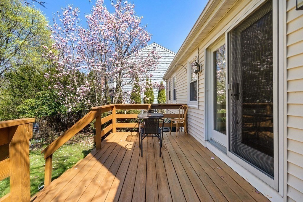 265 Riverside Drive Dedham, MA 02026 - Photo 22 of 41 a view of balcony with chairs and wooden fence