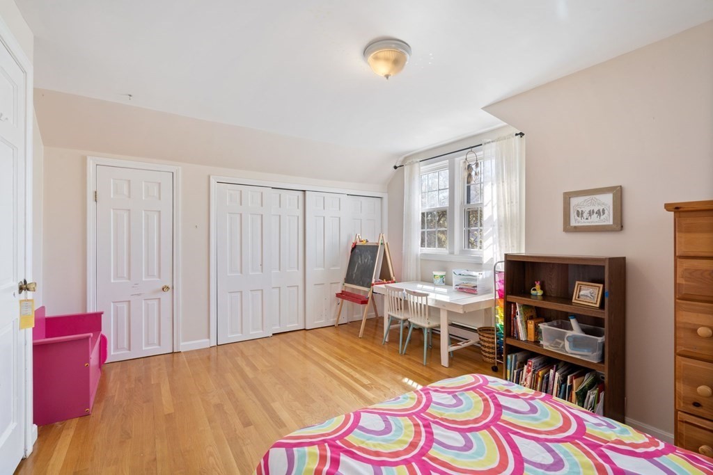 265 Riverside Drive Dedham, MA 02026 - Photo 29 of 41 a bed room with a bed and a chair