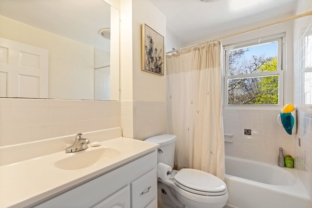 265 Riverside Drive Dedham, MA 02026 - Photo 30 of 41 a bathroom with a sink a toilet and a bathtub