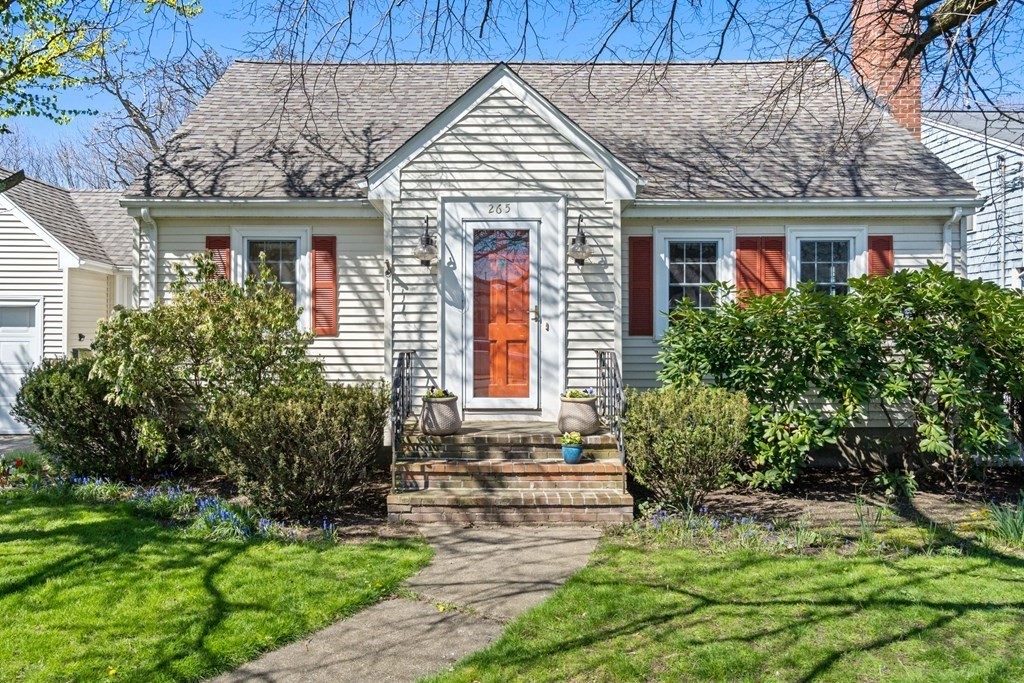 265 Riverside Drive Dedham, MA 02026 - Photo 3 of 41 a front view of a house with garden