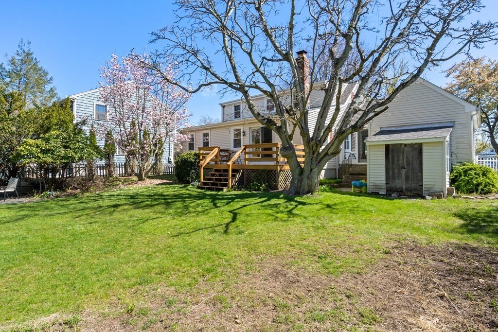 265 Riverside Drive Dedham, MA 02026 - Photo 35 of 41 a view of a house with backyard and a tree