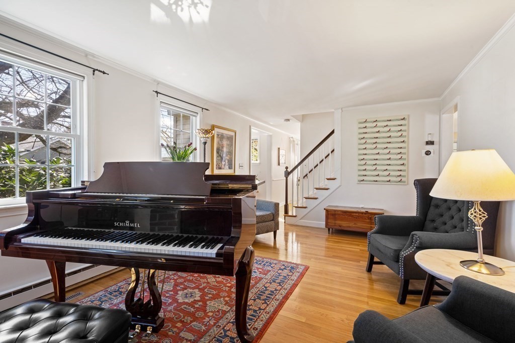 265 Riverside Drive Dedham, MA 02026 - Photo 6 of 41 a living room with furniture and a piano