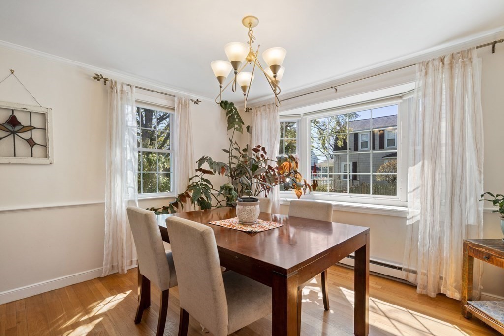 265 Riverside Drive Dedham, MA 02026 - Photo 7 of 41 a view of a dining room with furniture window and wooden floor