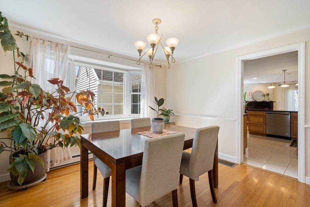 265 Riverside Drive Dedham, MA 02026 - Photo 9 of 41 a view of a dining room with furniture and wooden floor