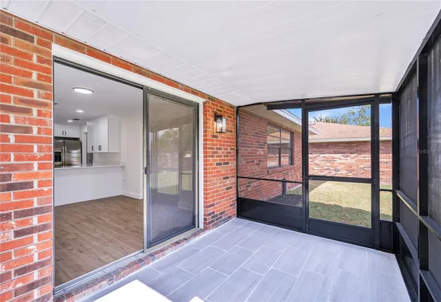 an empty room with large windows