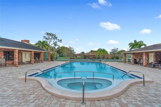 a swimming pool with outdoor seating yard and barbeque oven