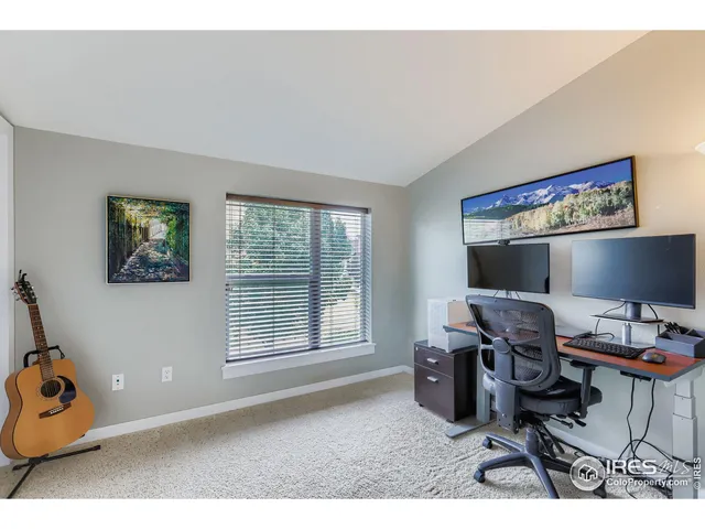 a workspace with furniture and a window
