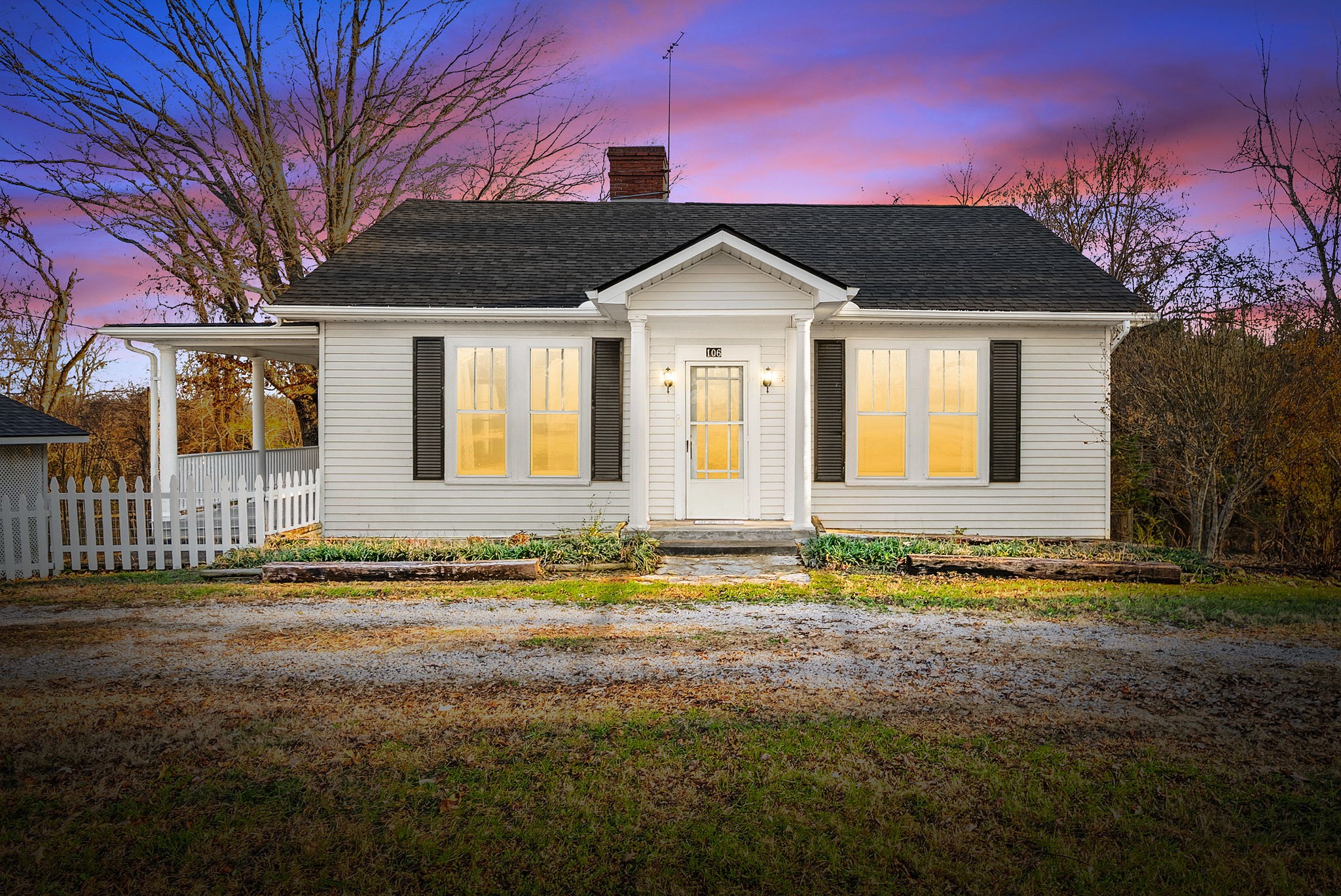 106 Cedar Street Dover, TN 37058 - Photo 1 of 32 a front view of a house with a yard