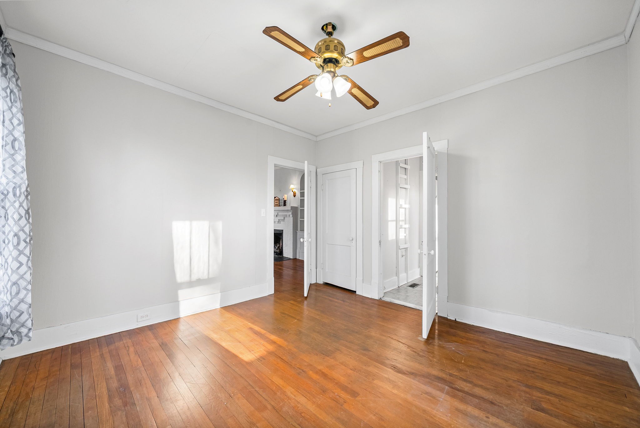 106 Cedar Street Dover, TN 37058 - Photo 17 of 32 an empty room with wooden floor and windows