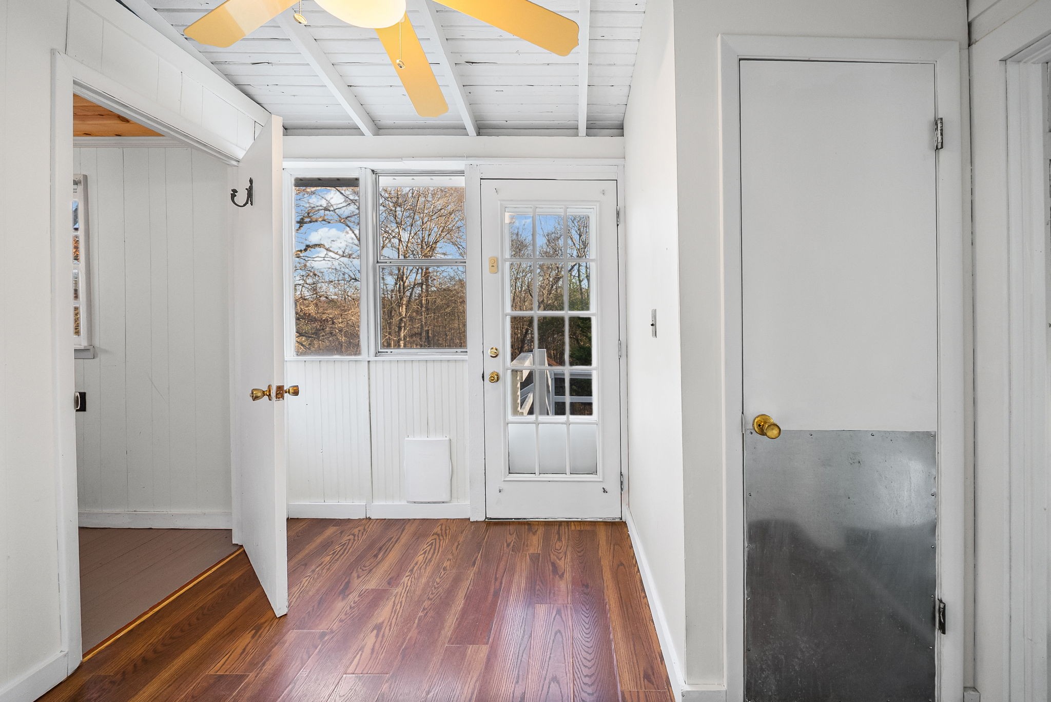 106 Cedar Street Dover, TN 37058 - Photo 18 of 32 a view of a hallway with wooden floor and a living room