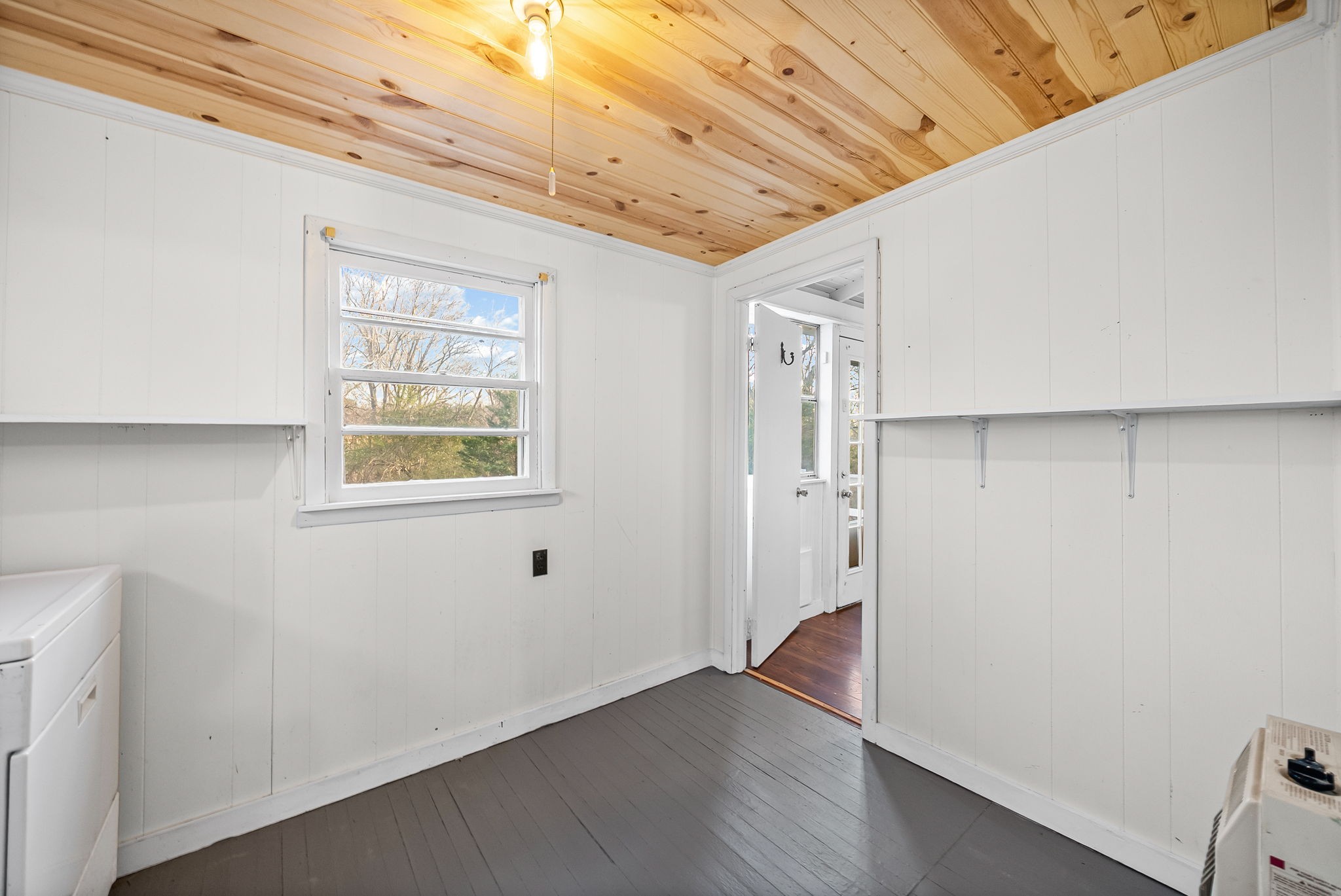 106 Cedar Street Dover, TN 37058 - Photo 19 of 32 a view of an empty room with wooden floor and a window