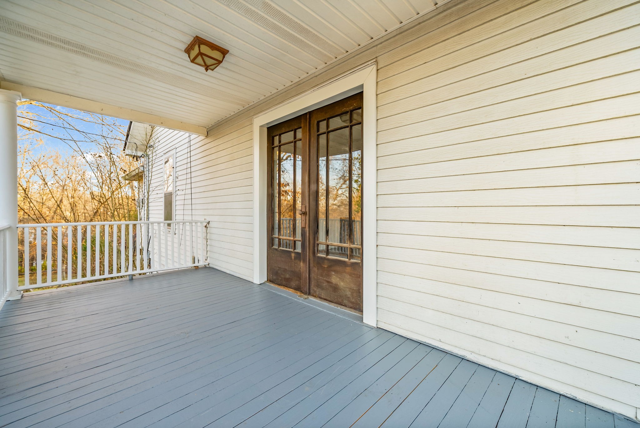 106 Cedar Street Dover, TN 37058 - Photo 24 of 32 an empty room with wooden floor and windows