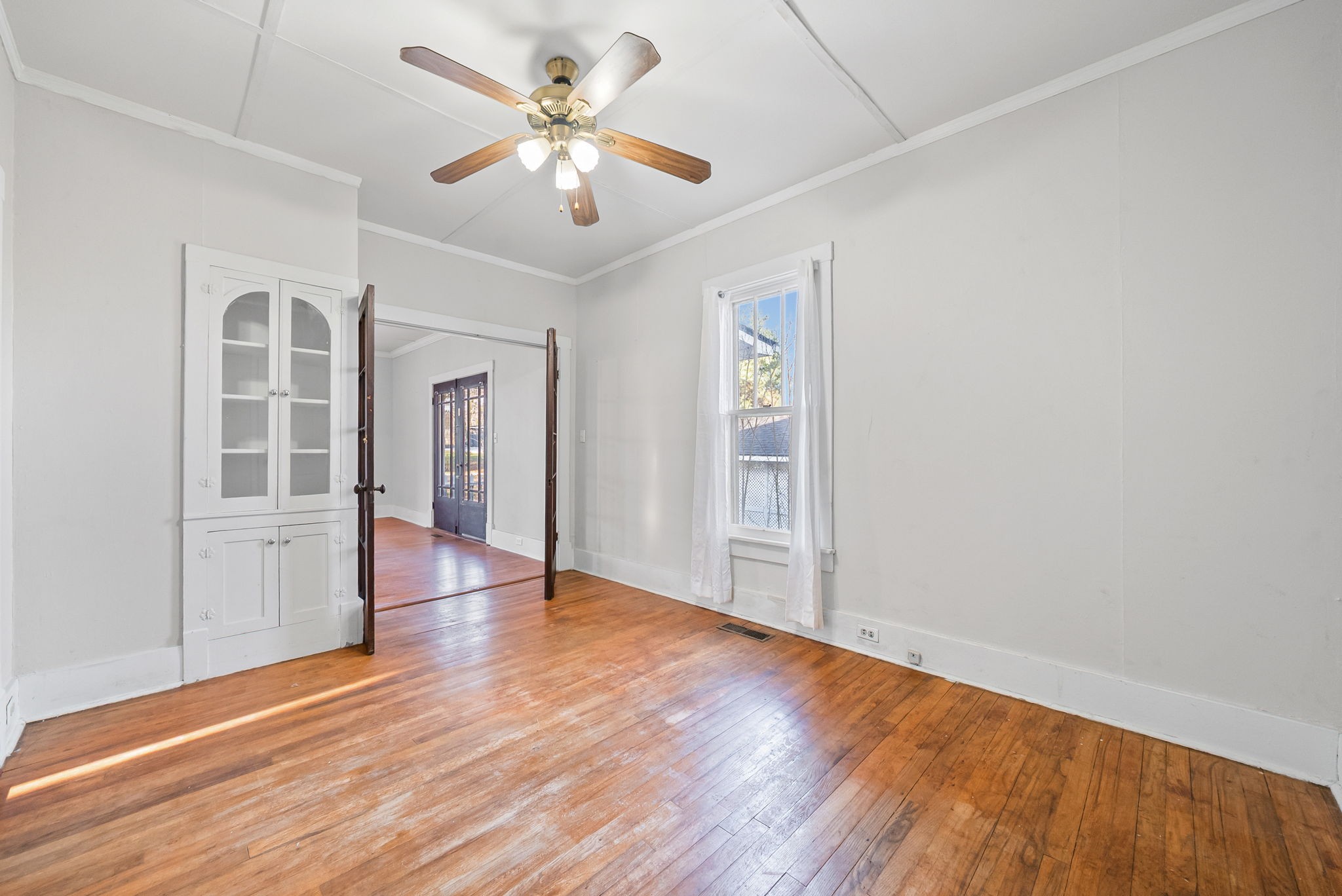 106 Cedar Street Dover, TN 37058 - Photo 10 of 32 an empty room with wooden floor and windows