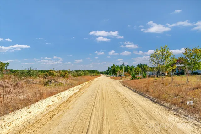 a view of lake with a city
