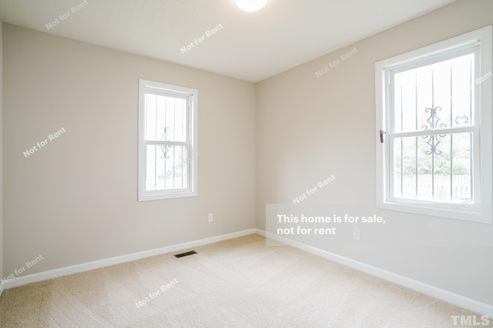 328 Chavis Way Raleigh, NC 27601 - Photo 22 of 27 a view of an empty room with a window