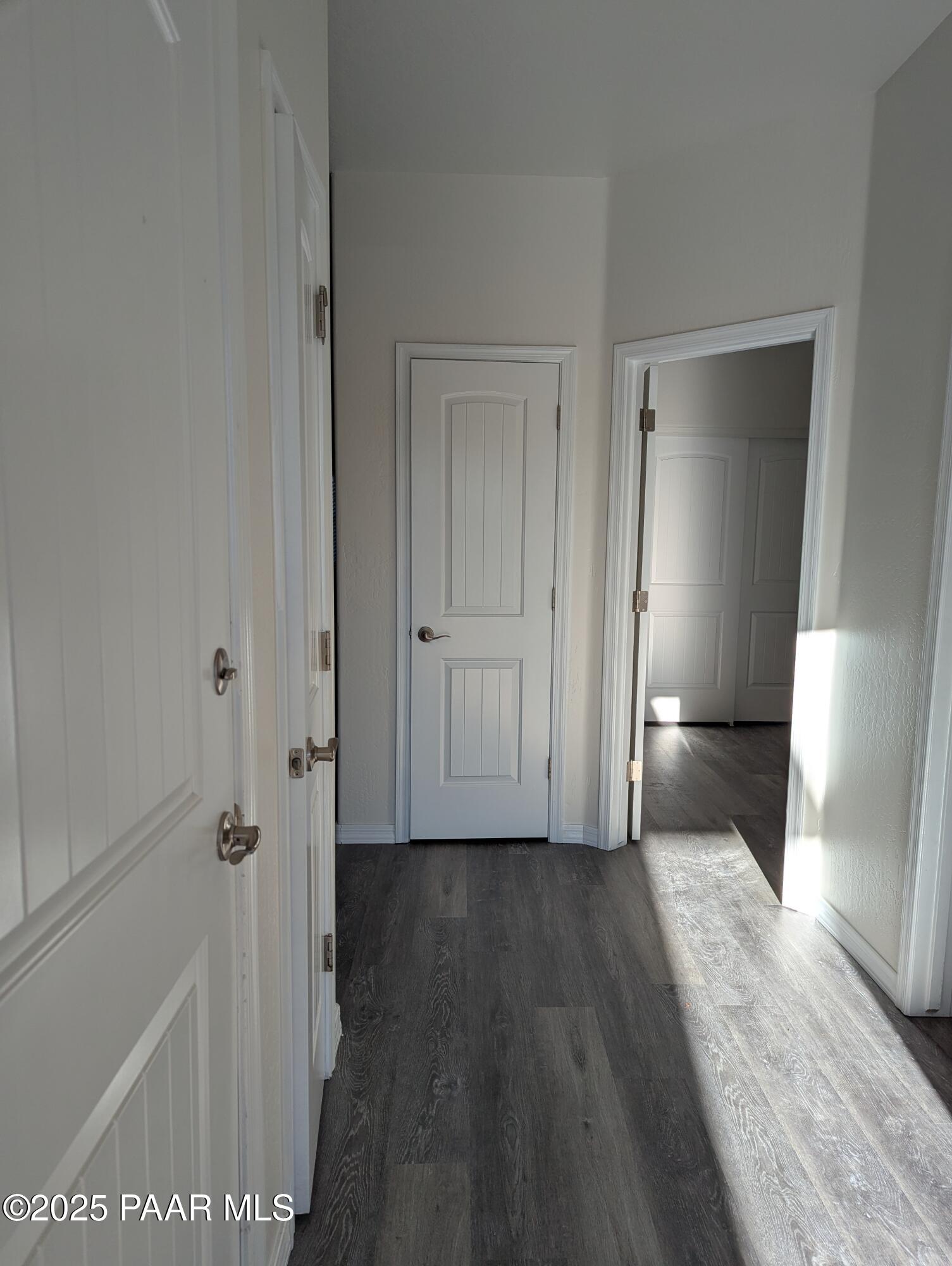 2976 North Yavapai Road East, Unit 2 Prescott Valley, AZ 86314 - Photo 2 of 12 a view of a hallway with wooden floor