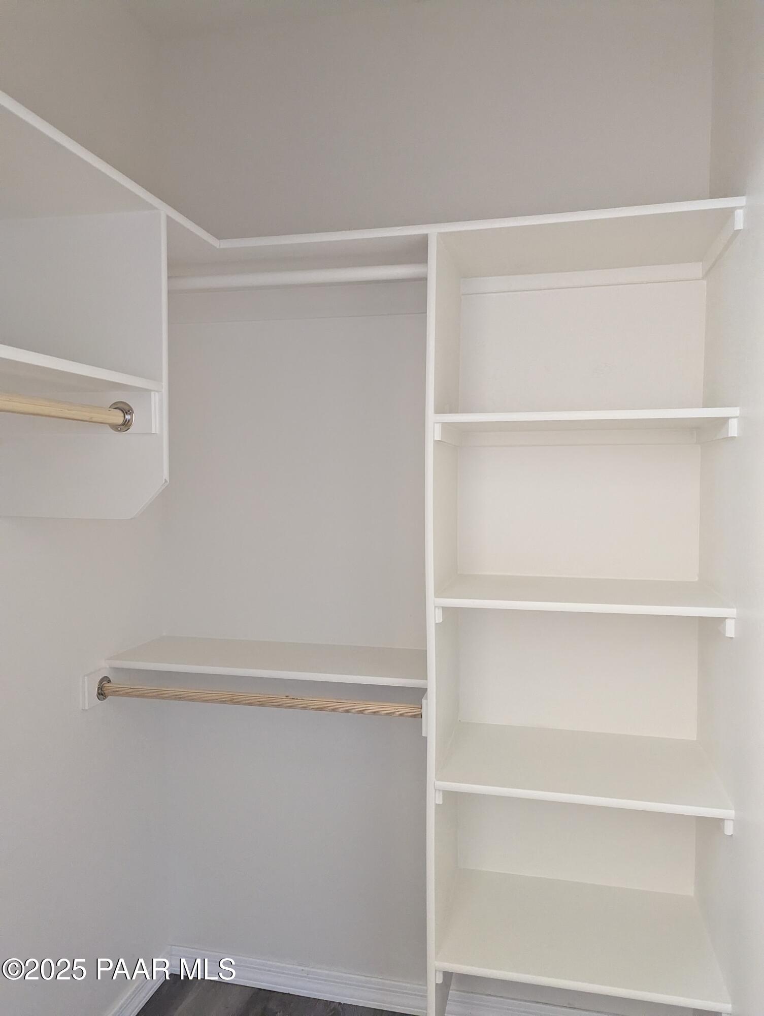 2976 North Yavapai Road East, Unit 2 Prescott Valley, AZ 86314 - Photo 6 of 12 a view of walk in closet with empty racks