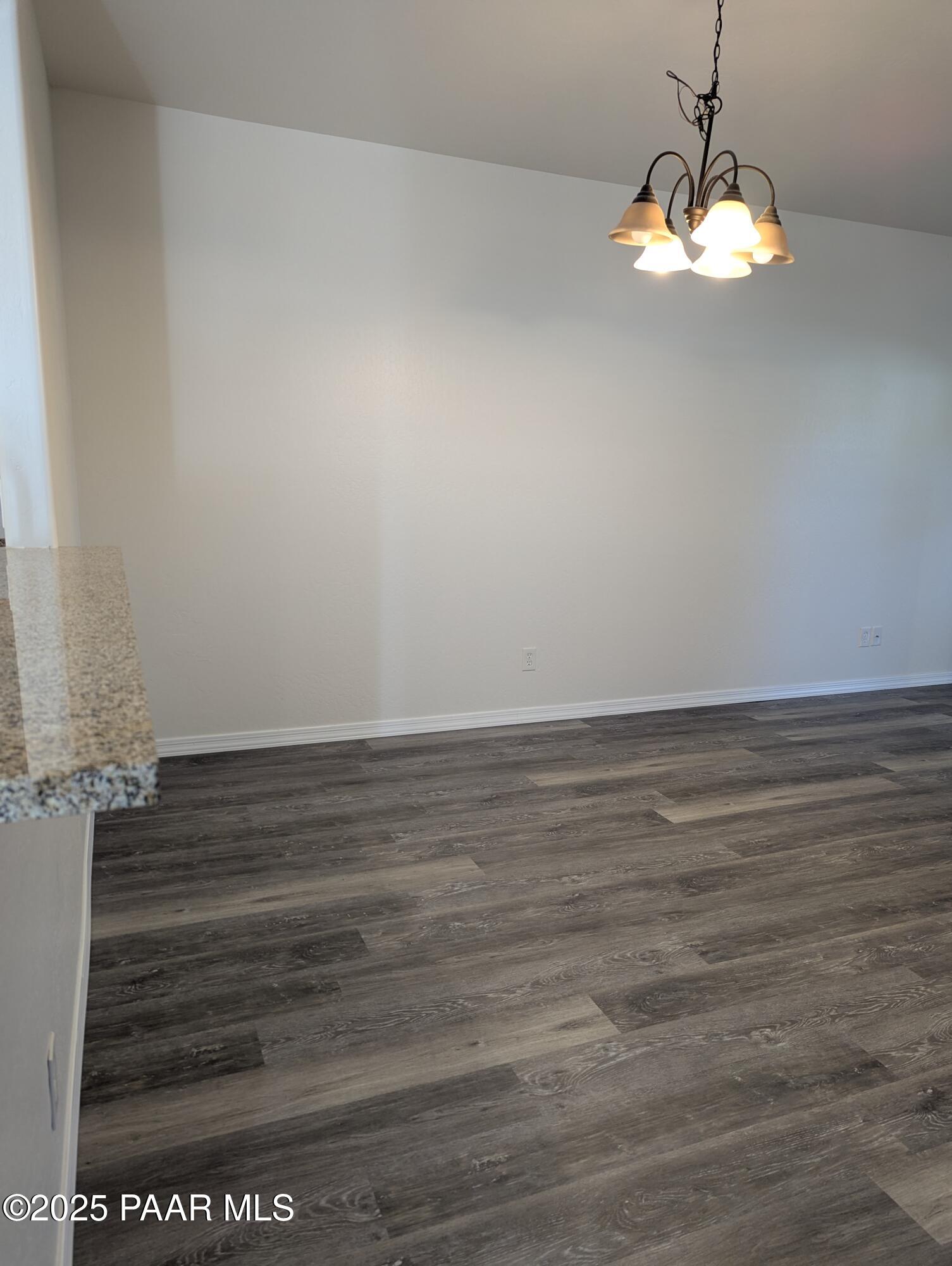2976 North Yavapai Road East, Unit 2 Prescott Valley, AZ 86314 - Photo 8 of 12 a view of a room with an empty space and a window