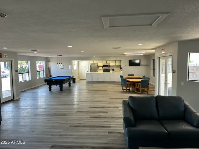 a living room with furniture and a table