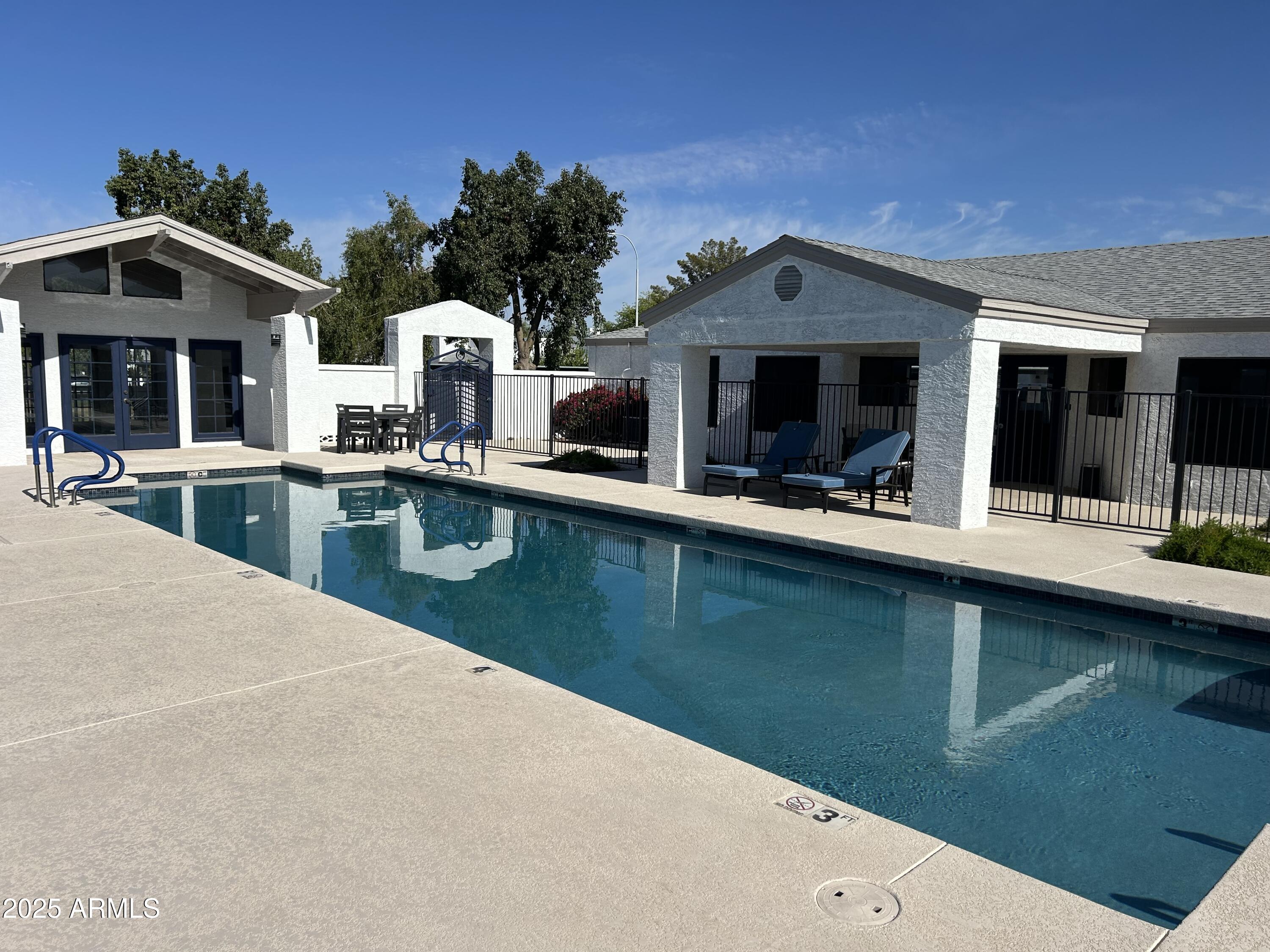 1444 North Recker Road, Unit 163 Mesa, AZ 85205 - Photo 16 of 19 a view of a house with outdoor kitchen