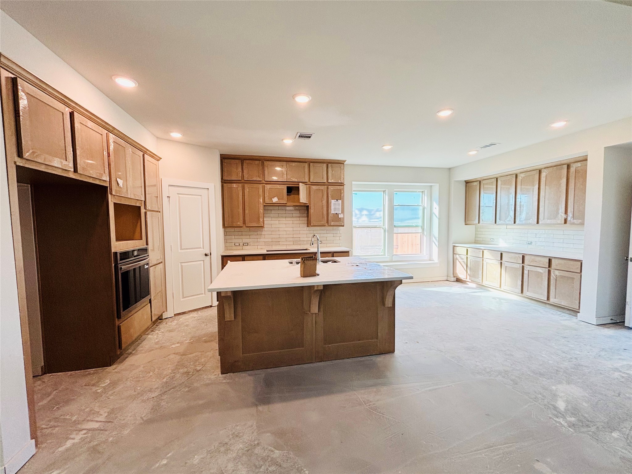 5314 Getty Lane Manvel, TX 77578 - Photo 5 of 17 a large kitchen with stainless steel appliances granite countertop a large counter top and a refrigerator